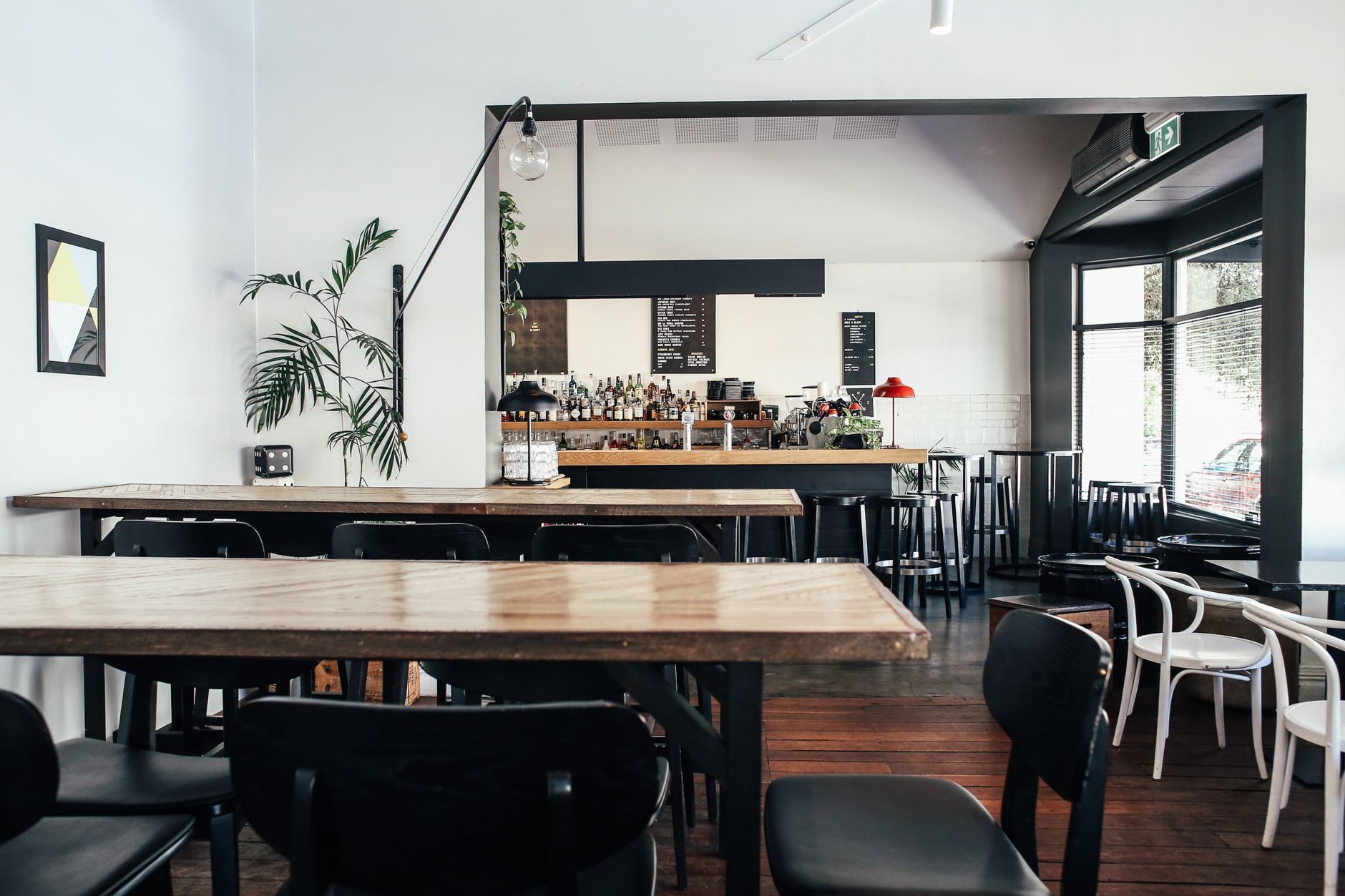 Modern minimalist cafe interior with wooden tables